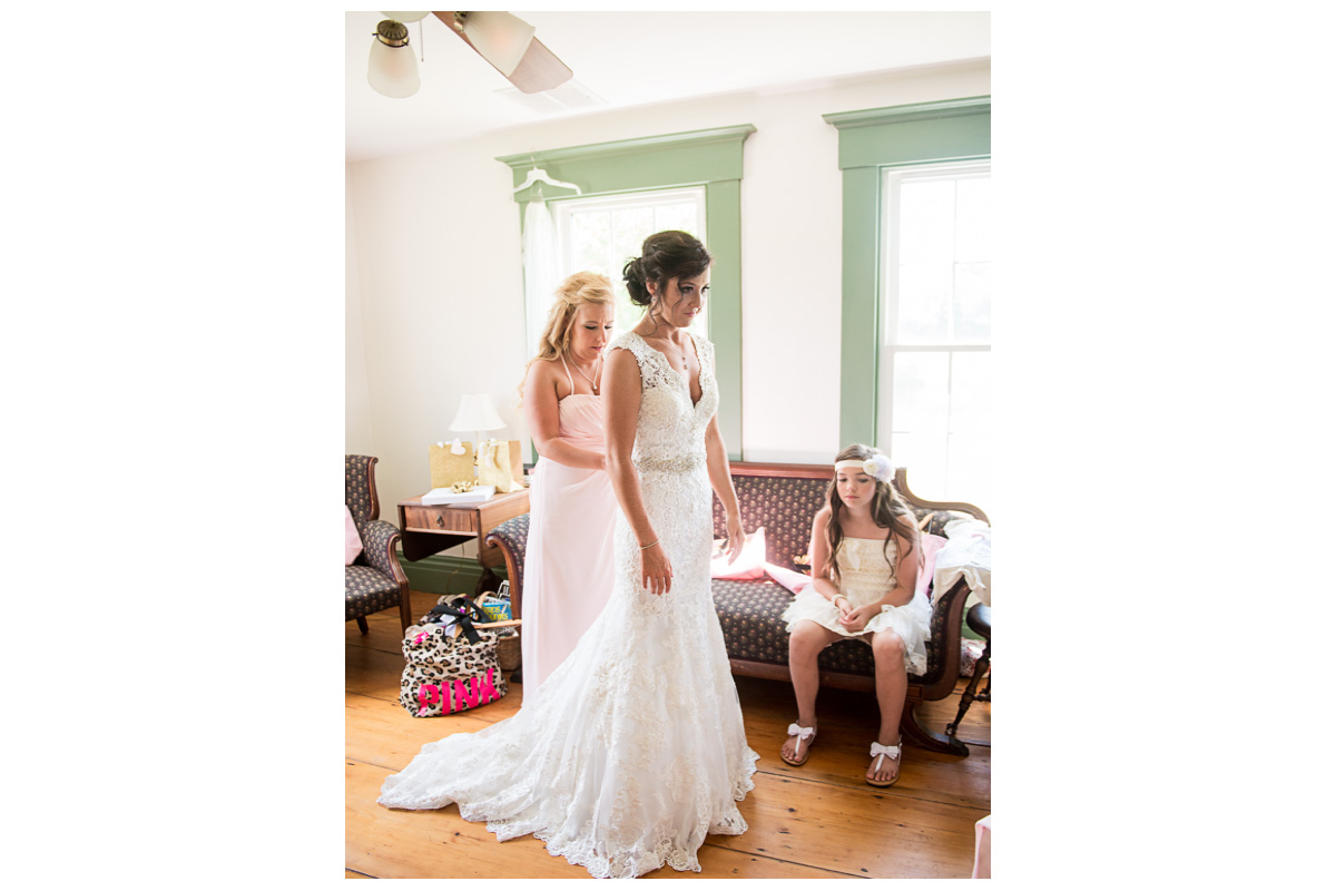 bride in farm home in lace wedding dress