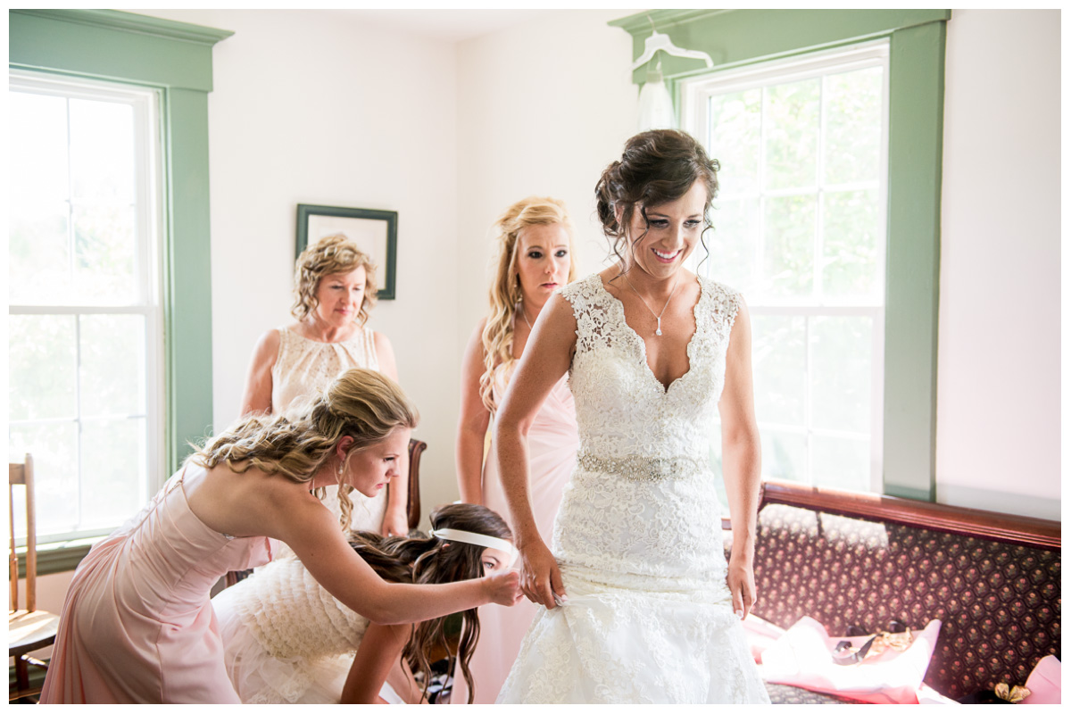 excited bride in lace wedding dress on wedding day