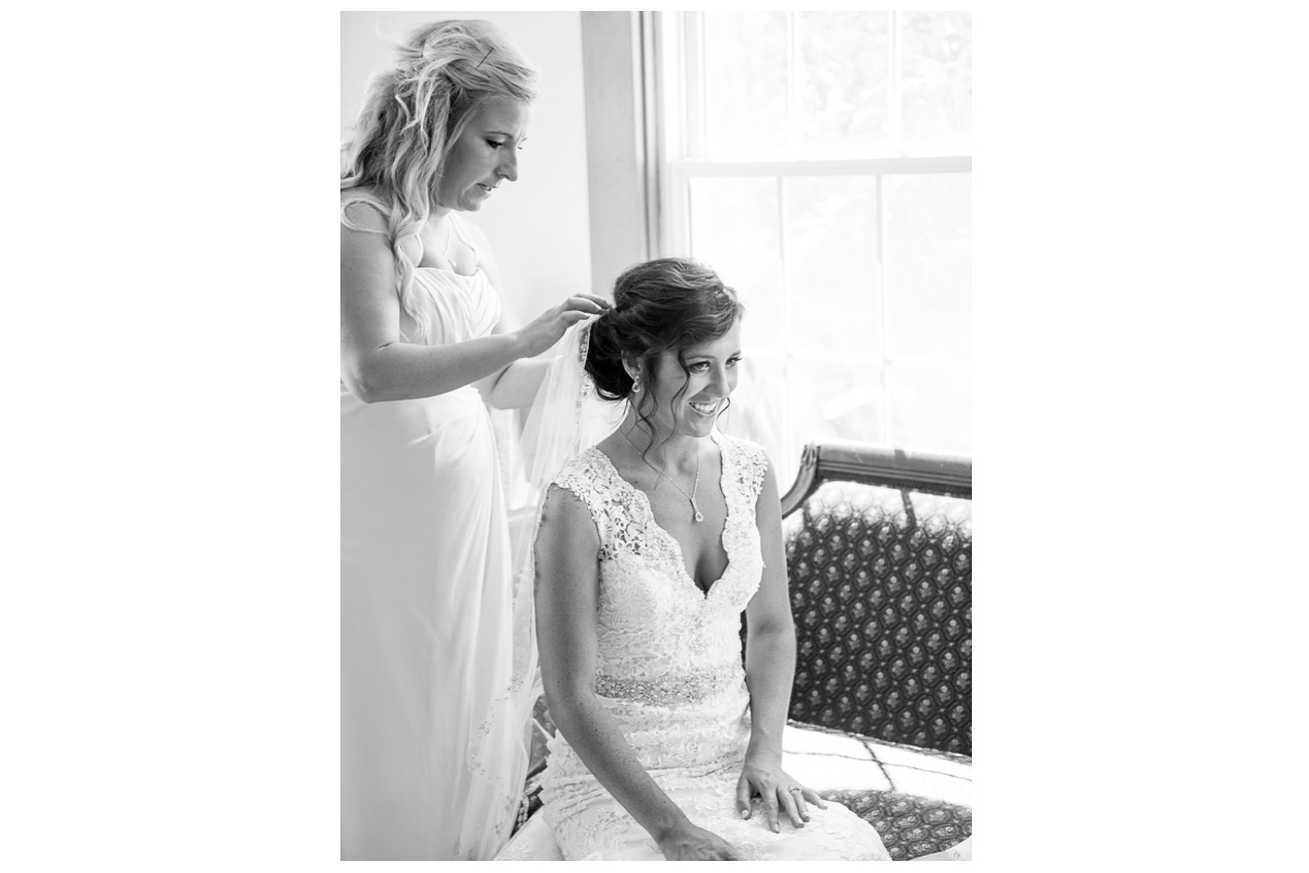 black and white photo of bride getting ready on wedding day