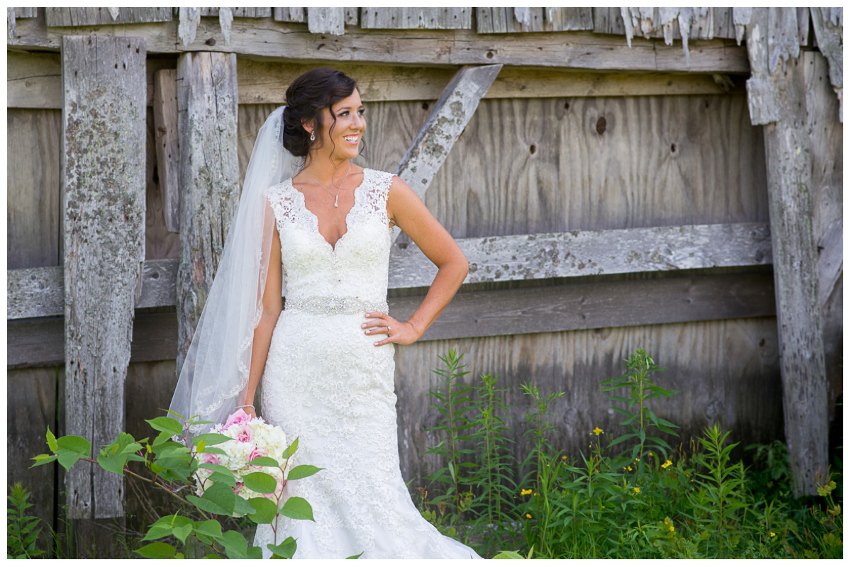 bride in front of barn on maine wedding day