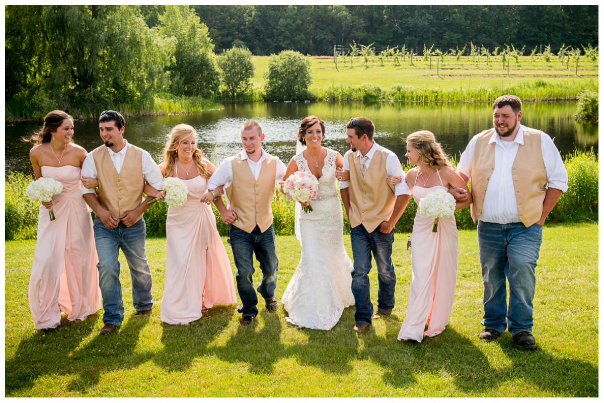 wedding party for farm wedding near a pond