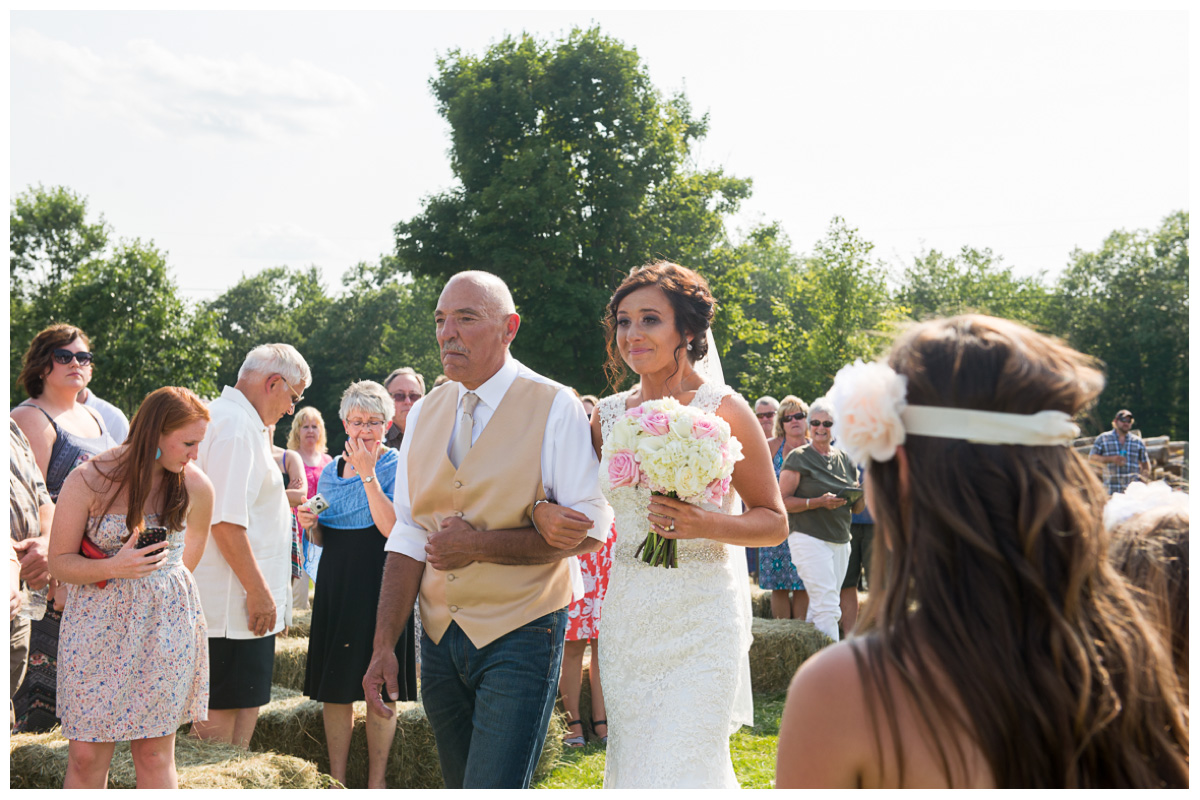 bride crying walking down the aisle 