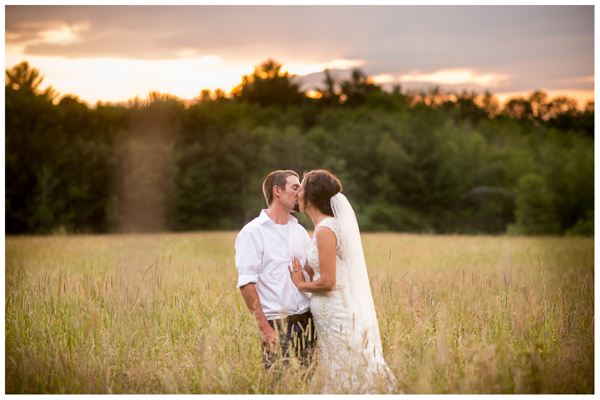 farm maine wedding with couple in wheat field