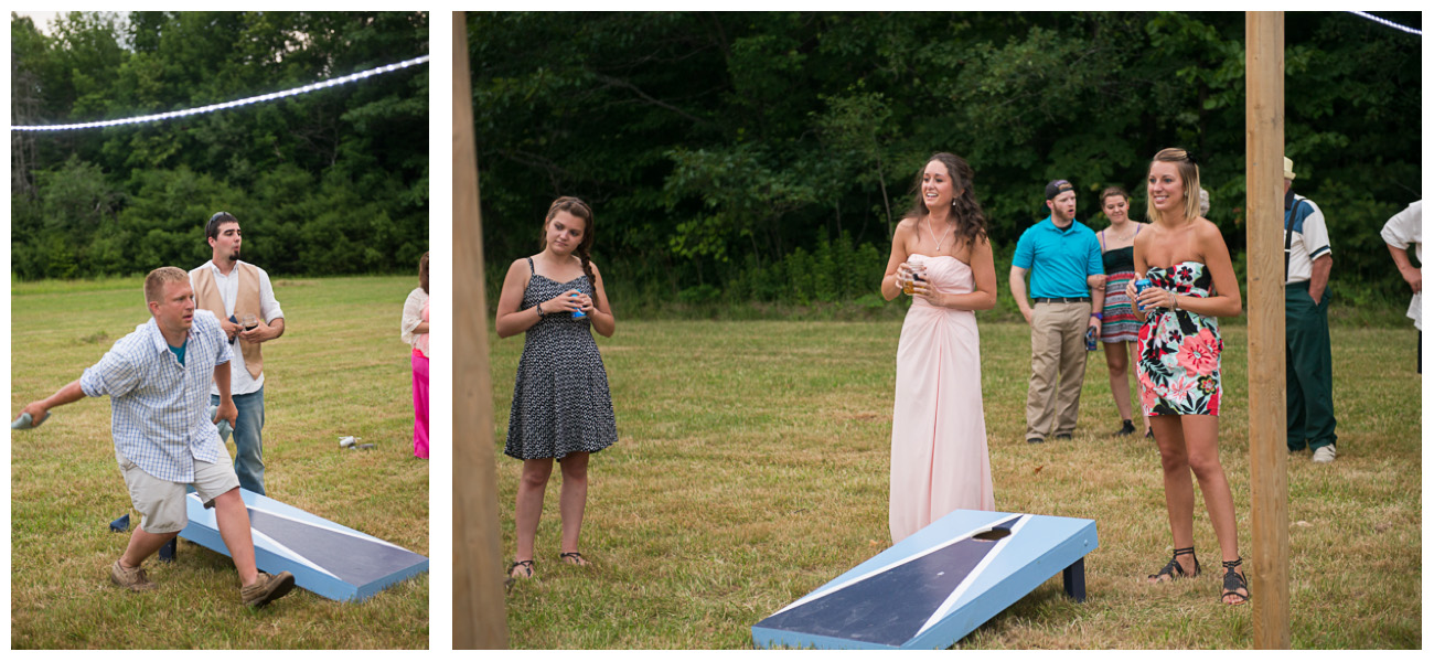 guests playing corn hole at outside wedding reception