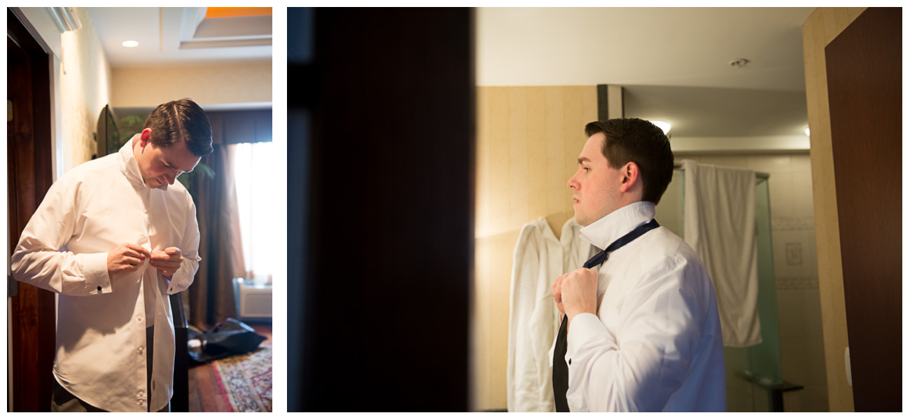 groom tying tie for wedding