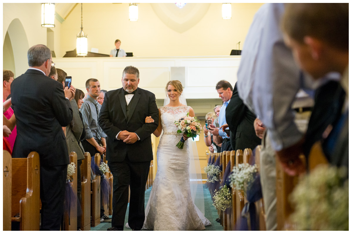 bride walking down the aisle in church wedding