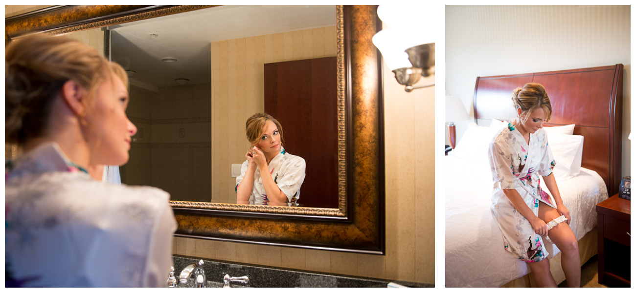 bride in white robe looking in mirror 