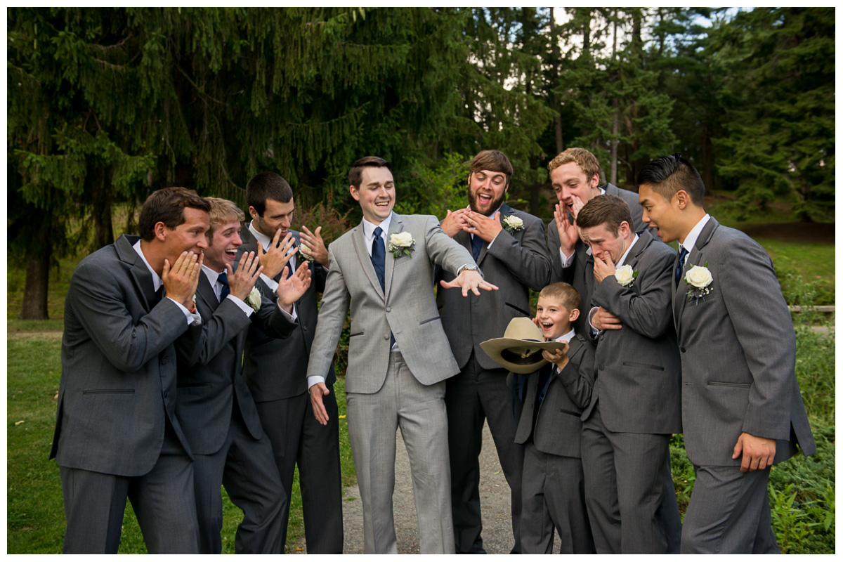 Groom and groomsmen's looking at wedding ring