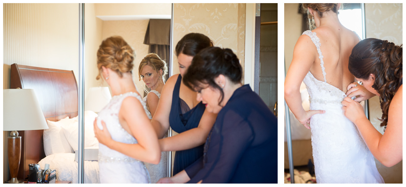 mother and sister helping bride get ready on wedding day