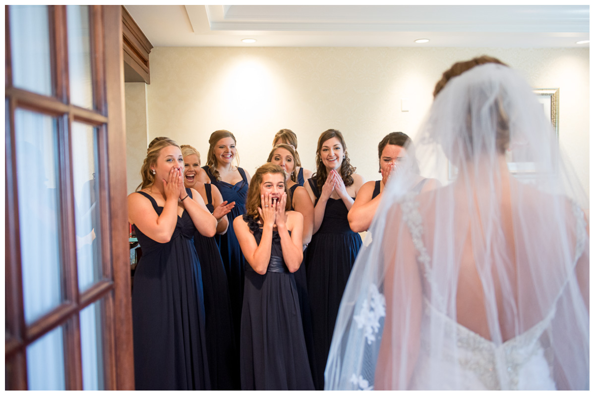 bride first look with bridesmaids before wedding