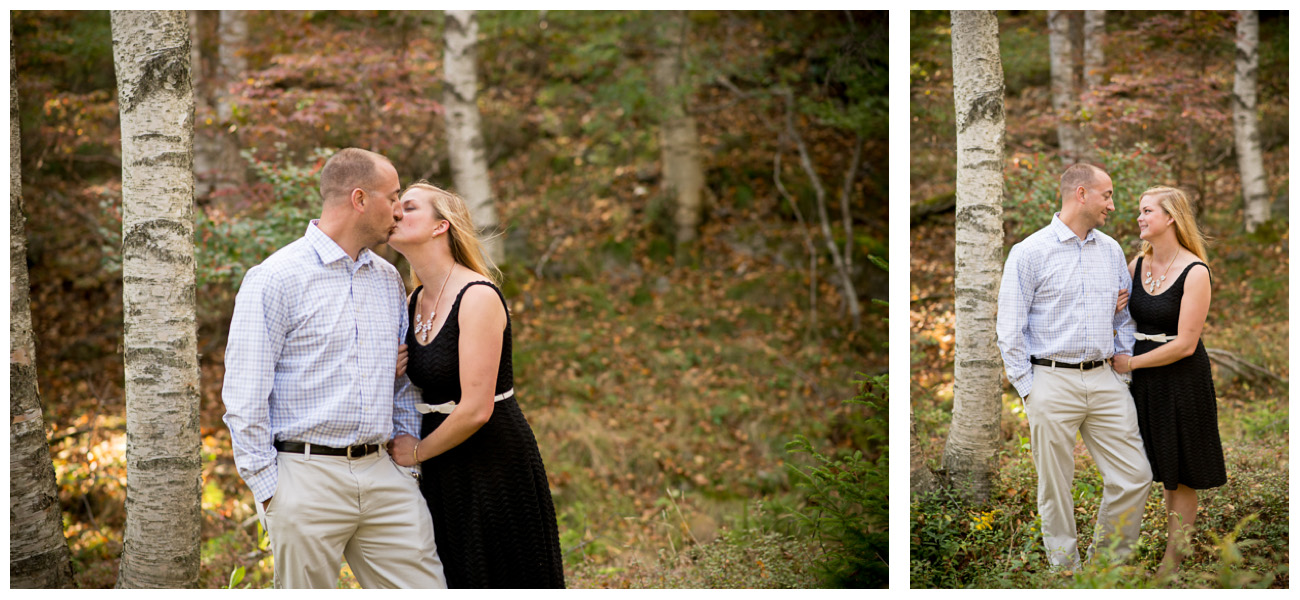 couple kissing in dressy clothes in forest in Maine