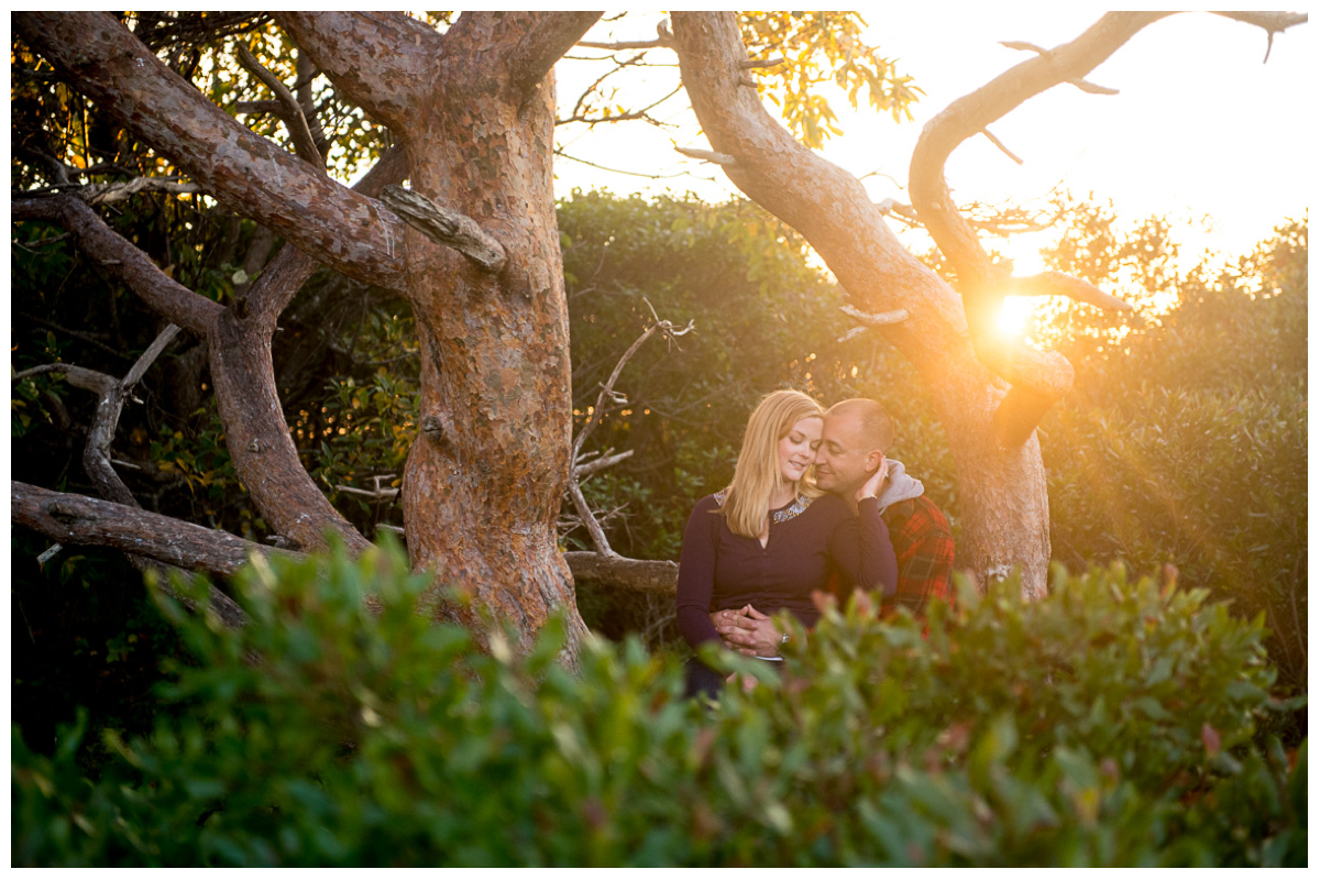 loving couple sitting together at sunset