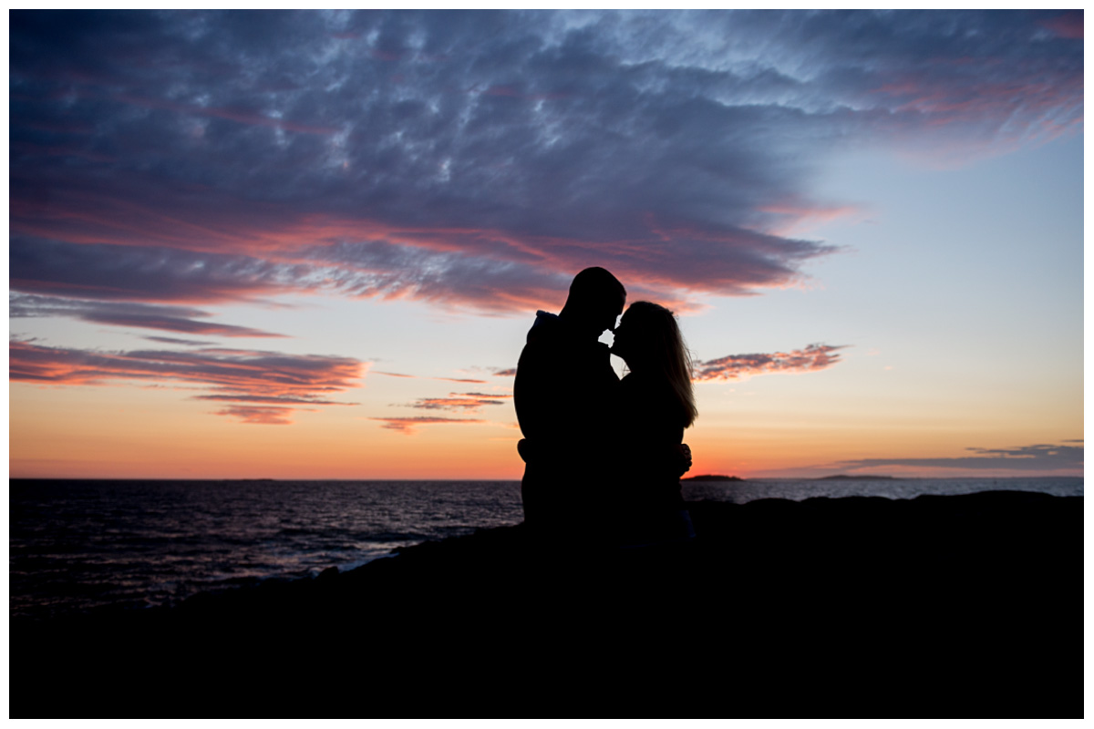 maine beach engagement photos at sunset with colorful sky