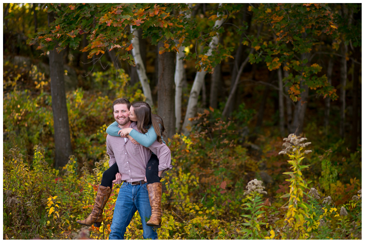 couple piggy backing in Cape Elizabeth by the ocean