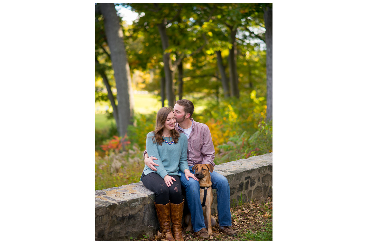 fun couple with dog in fort william's for engagement photos