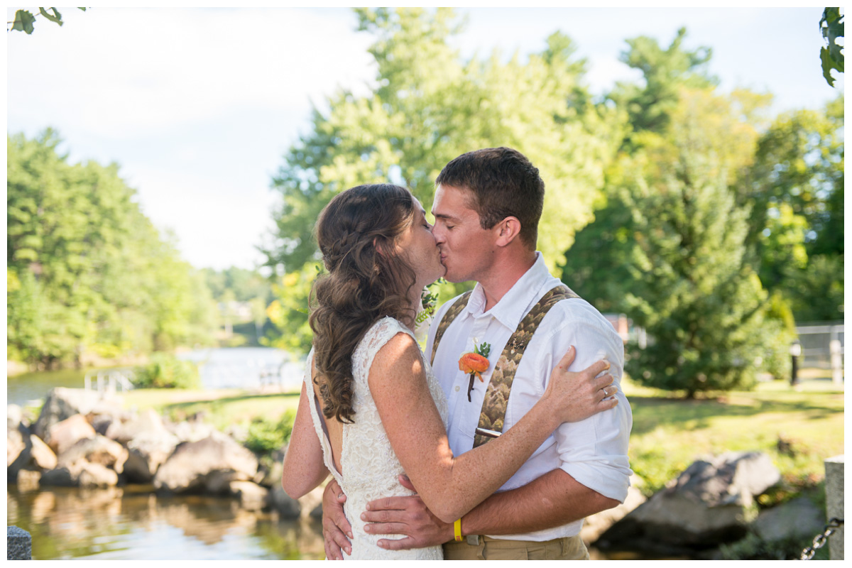 bride and groom kissing during first look new hampshire wedding