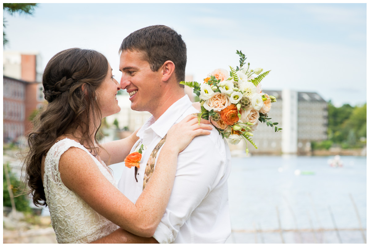 dreamy photo of bride and groom next to river