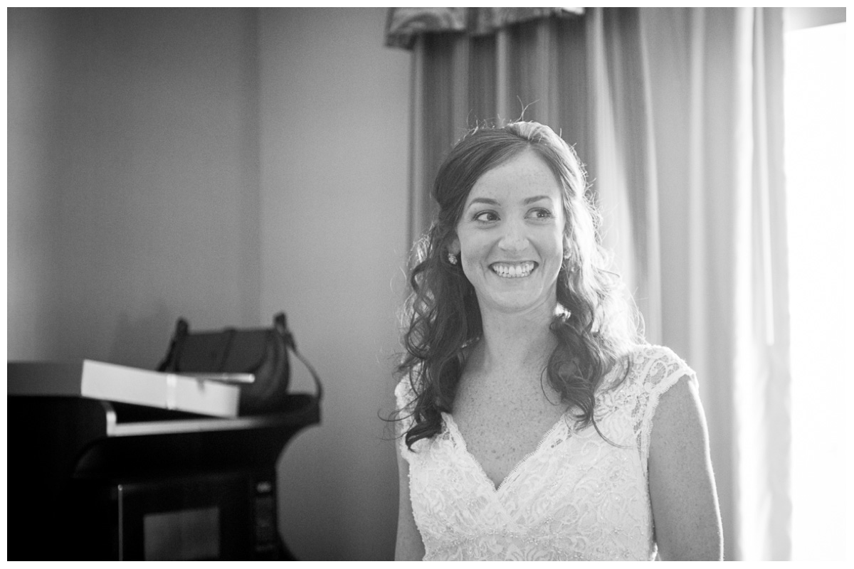 black and white photo of bride getting ready on wedding day