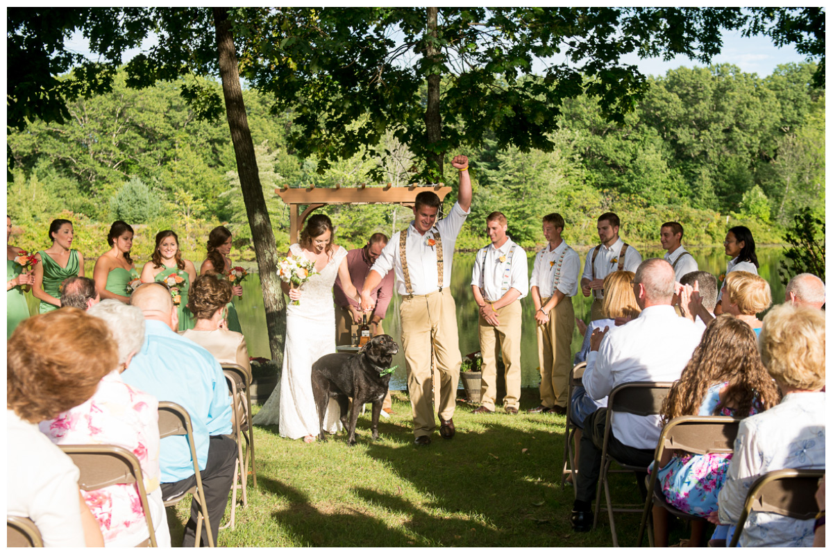 excited couple walking down aisle after wedding ceremony