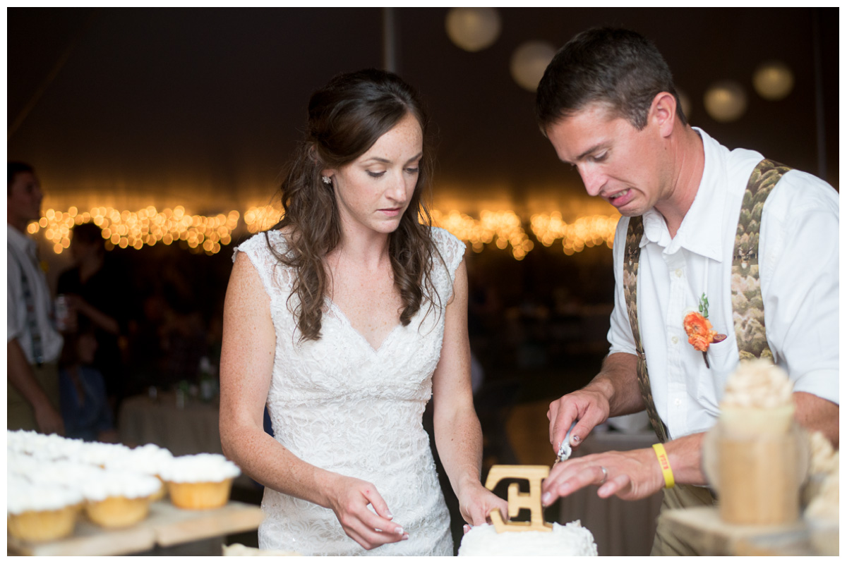 Bride and groom reactions during cake cutting