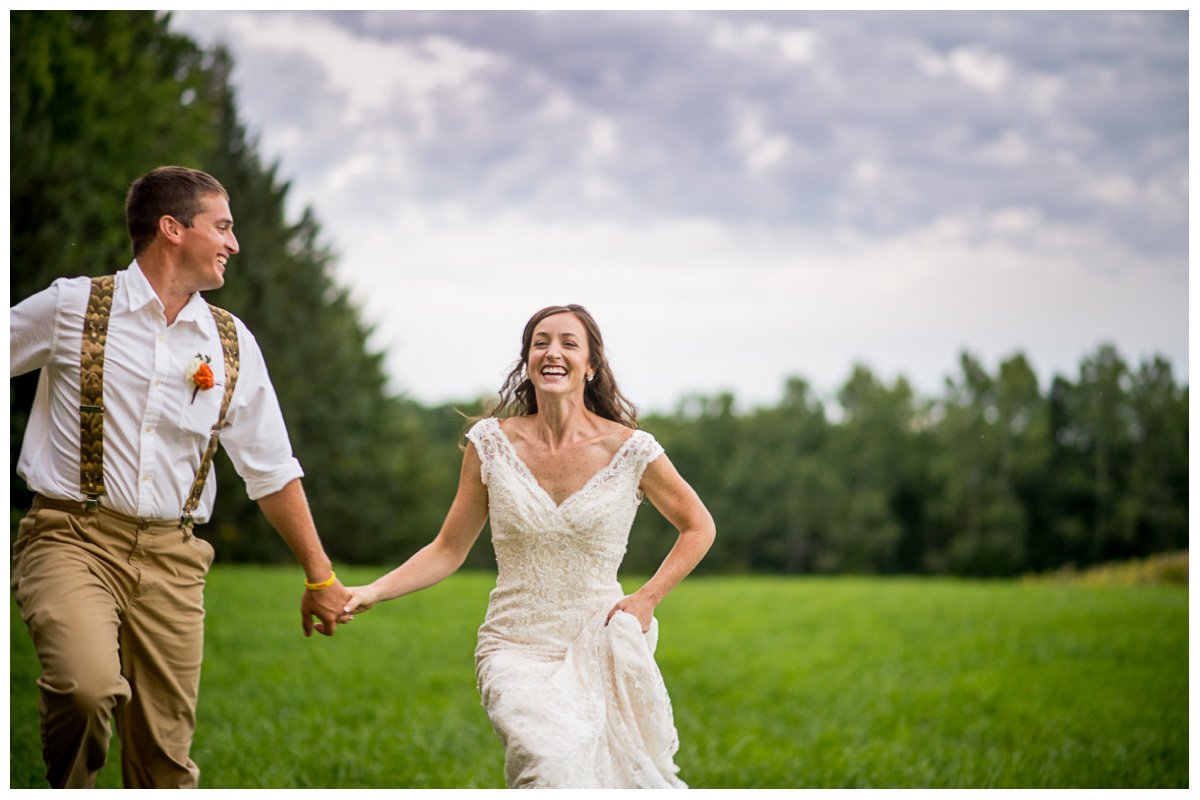 bride and groom laughing at sunset