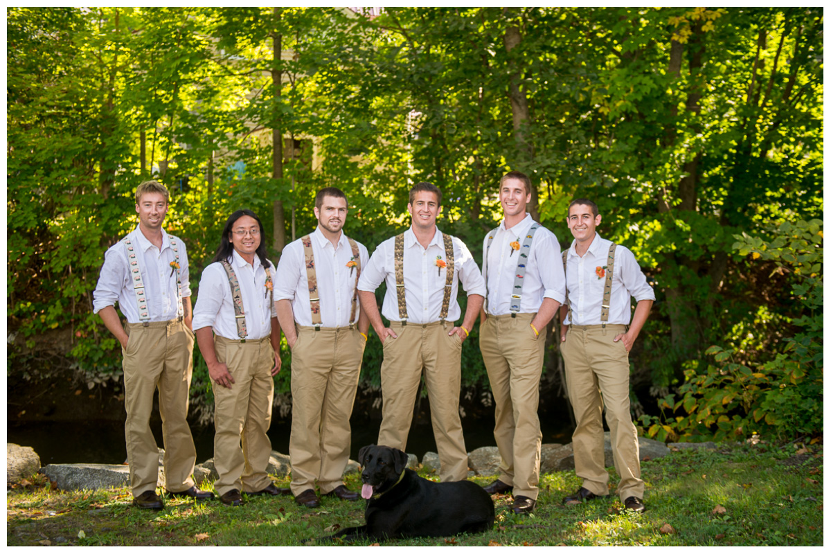 groomsmen in suspenders with khaki pants and dog 