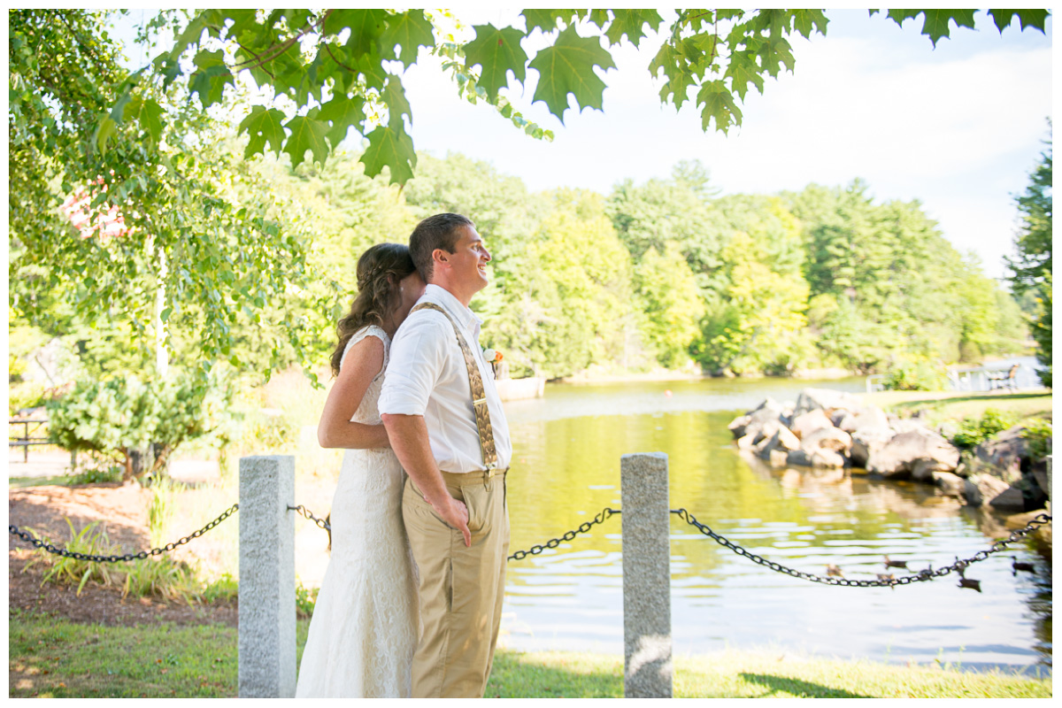 bride and groom during first look by the river