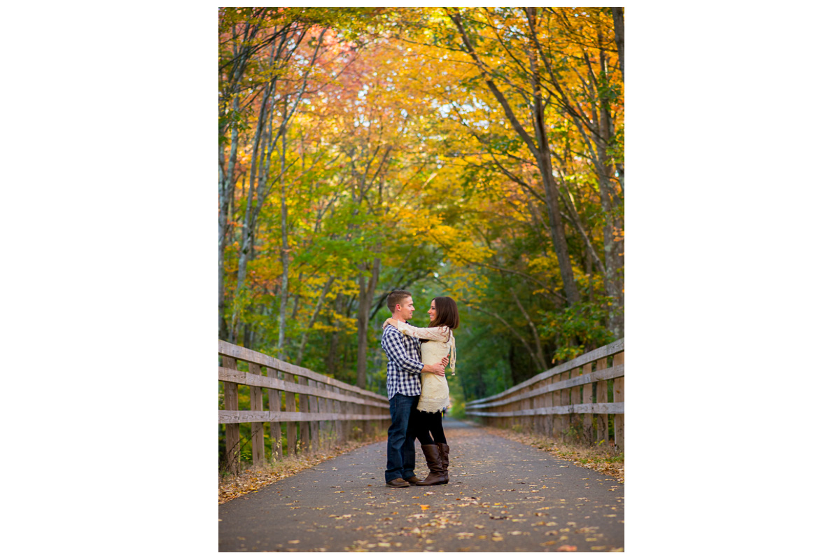 engagement photos on rail trail in chelmsford during fall 
