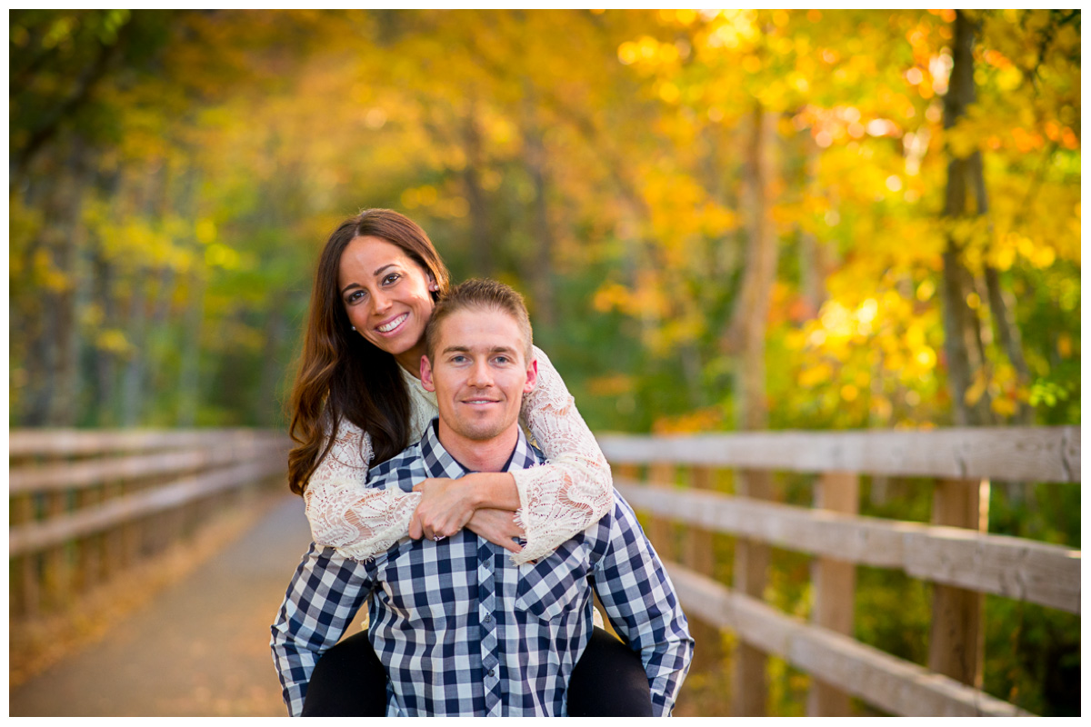vivid fall engagement photos with yellow and orange leaves