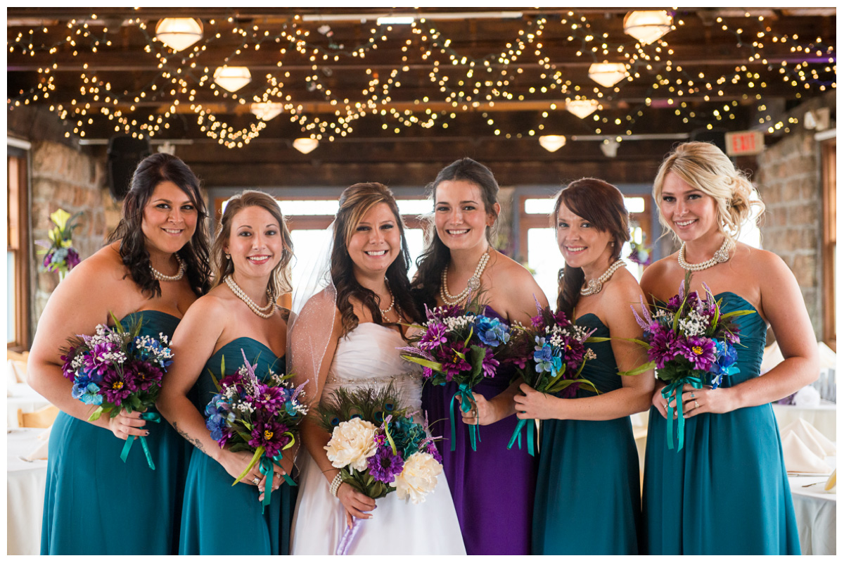 bride with bridesmaids on wedding day