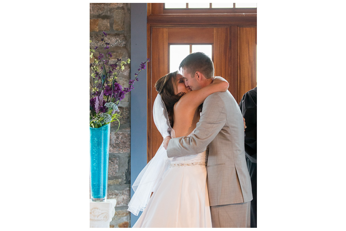 happy couple kissing during wedding ceremony