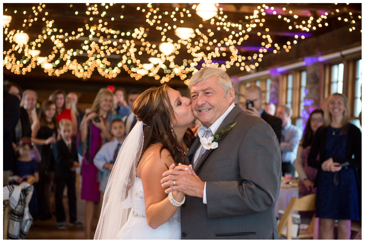 bride kissing dad during dance