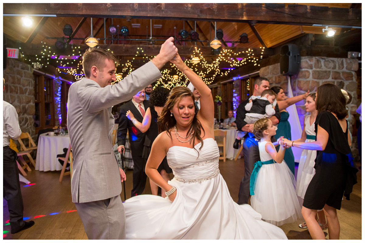Fun couple dancing during wedding reception