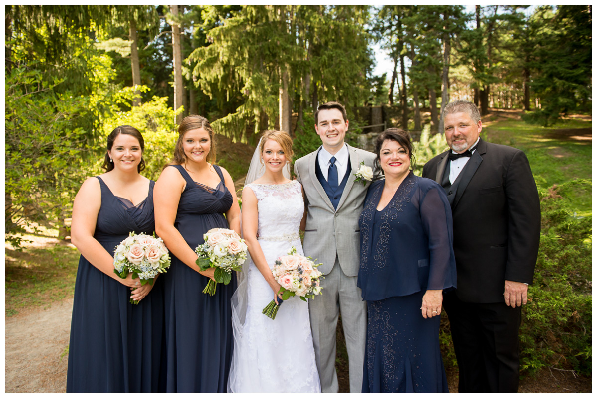Bride and groom with bride's family in a maine park