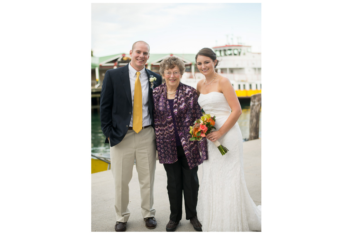 bride and groom with grandmother during family photos at portland maine wedding