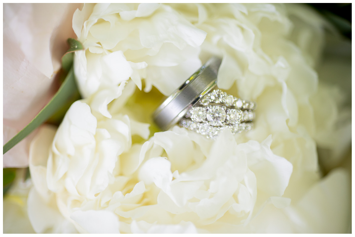 white gold wedding rings in flowers