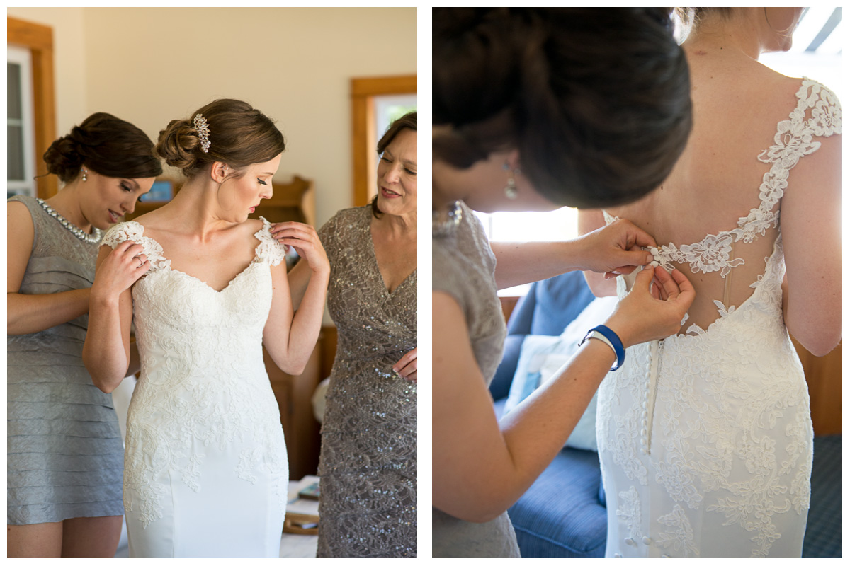 Mother and sister helping bride into wedding dress in Casco Maine