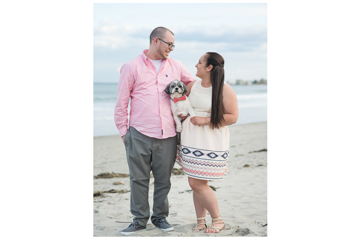 Happy couple on Rye Beach with dog 