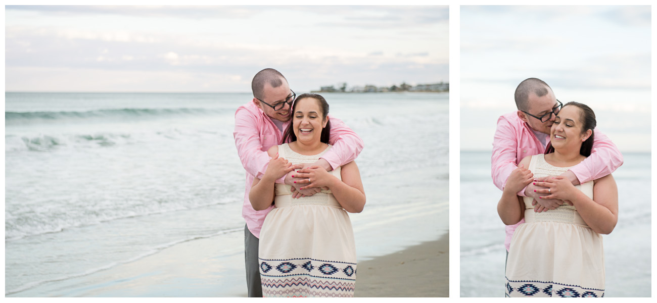 couple laughing during engagement photos on the beach in new hamsphire 