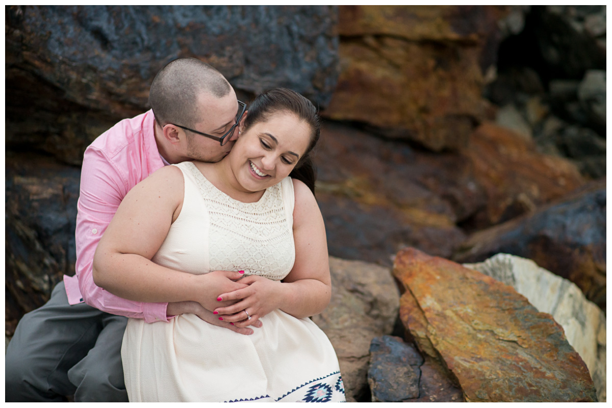 Genuine couple on beach for engagement photos 