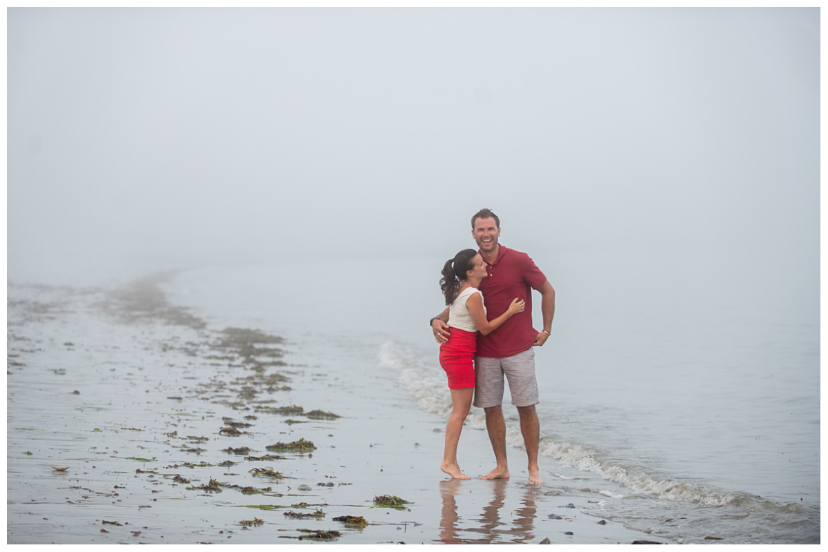 couple after engagement proposal on a beach