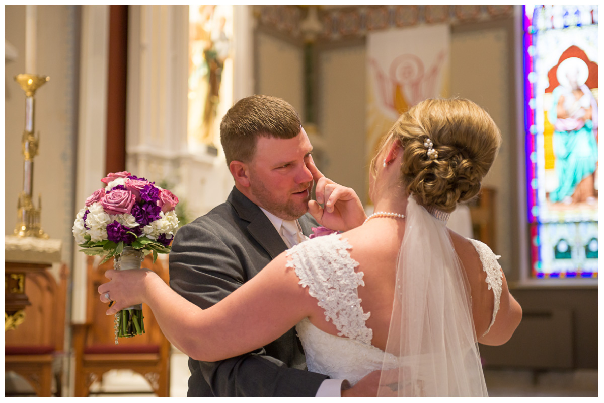 groom crying during first look with bride on wedding day