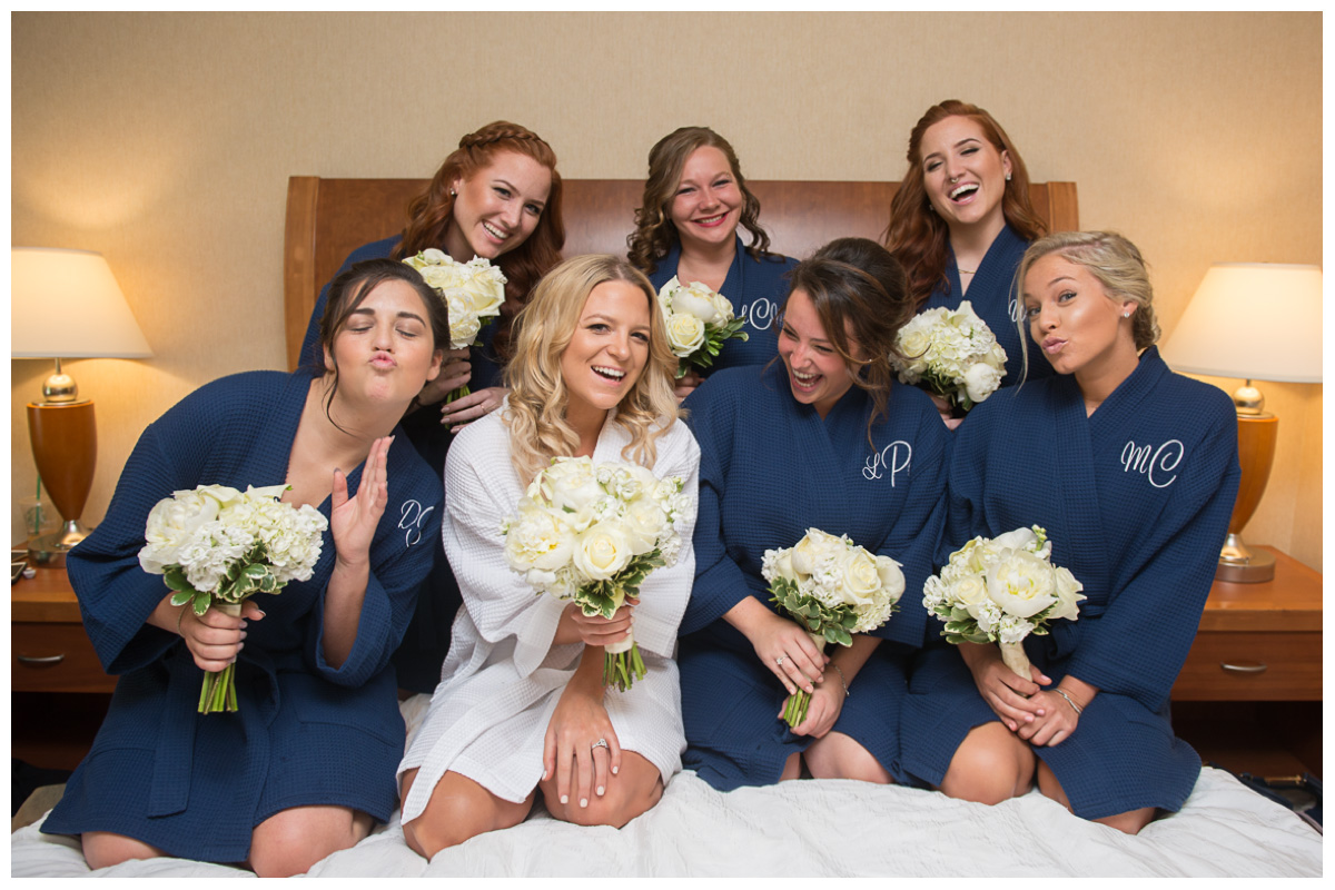 fun photos with bridesmaids in robes in hotel getting ready