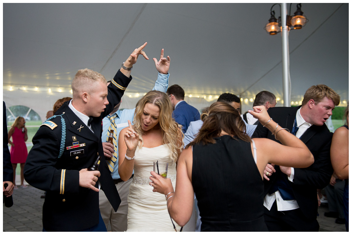 bride and groom dancing at tented maine reception