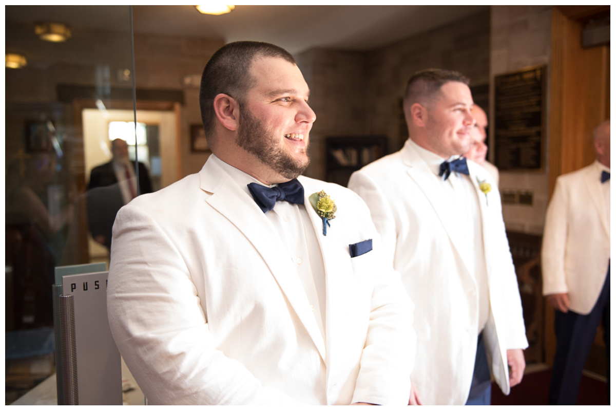 Groom seeing bride on wedding day in Greek Church