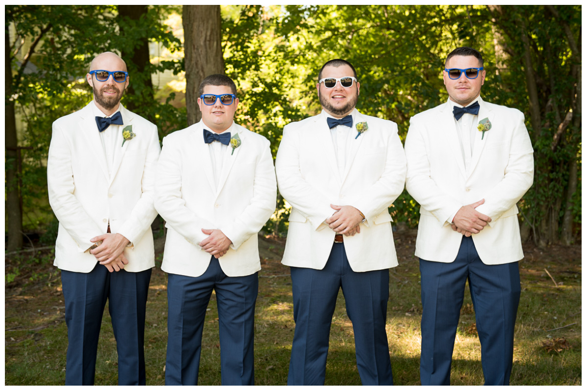 groom with groomsmen with sunglasses
