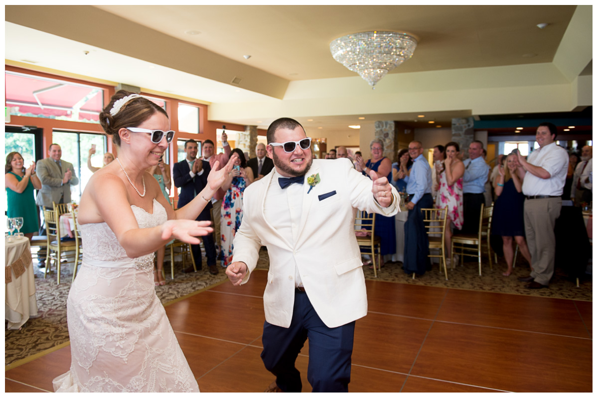 fun couple at wedding reception