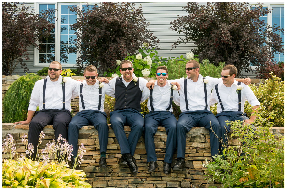 groomsmen with sunglasses and navy suits