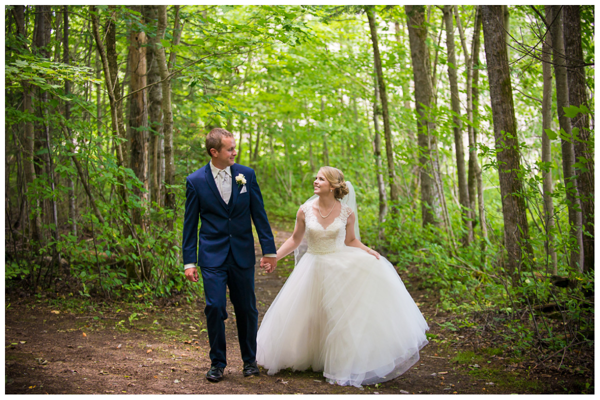 happy couple in the woods on wedding day