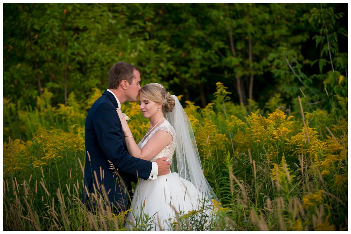 intimate wedding photos in field with yellow flowers